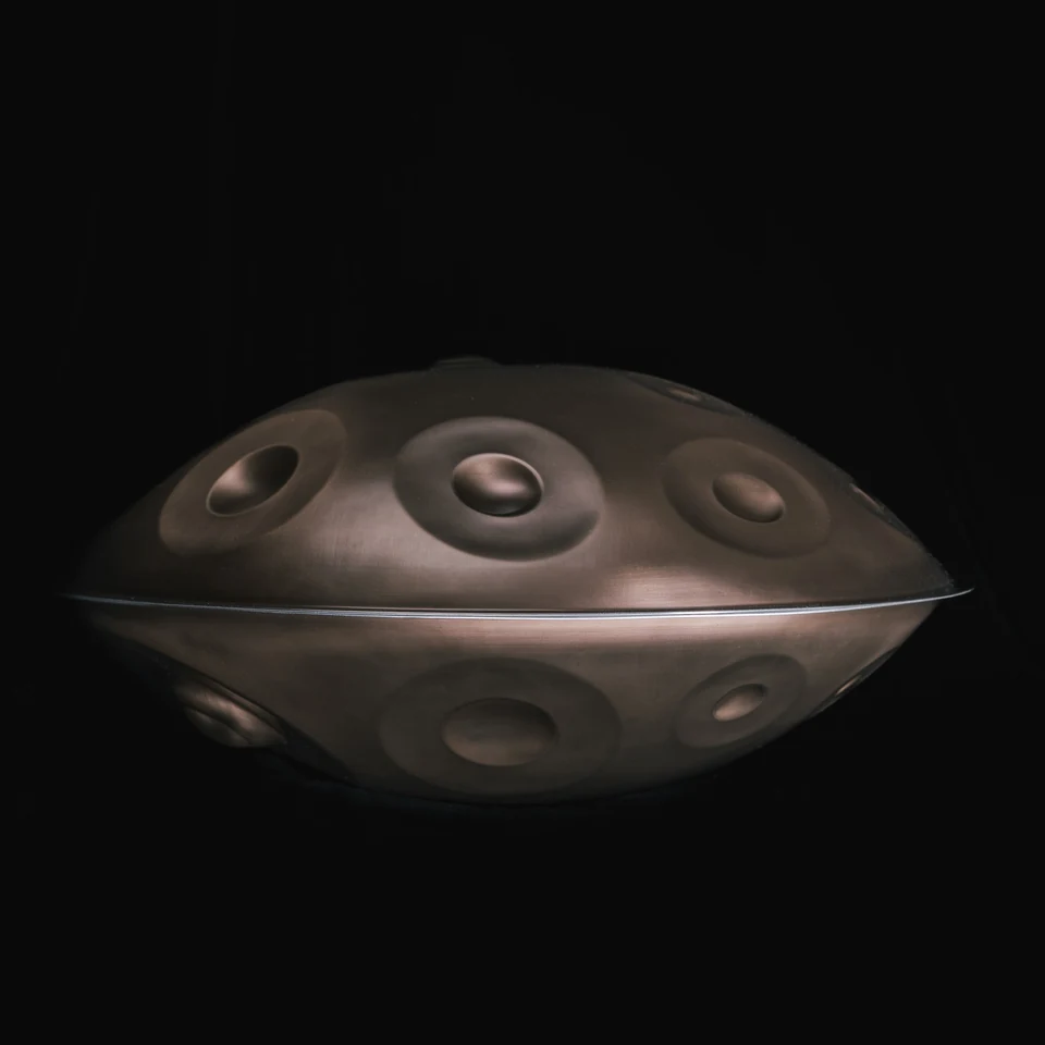 Bronze AYA Sounds handpan, sculpted tone fields and curved shell